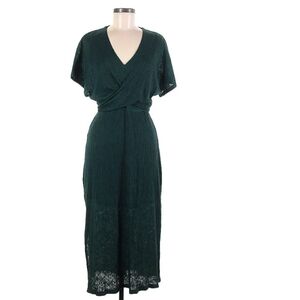 Flouret Studios black short sleeve dress with ribbed textured fabric. V neck det